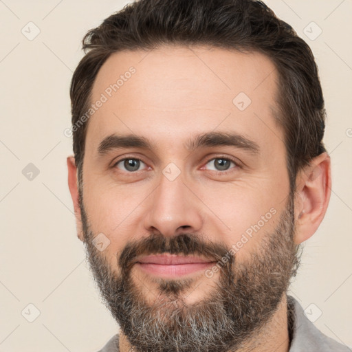 Joyful white adult male with short  brown hair and brown eyes