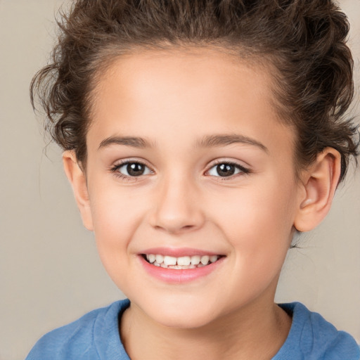 Joyful white child female with medium  brown hair and brown eyes