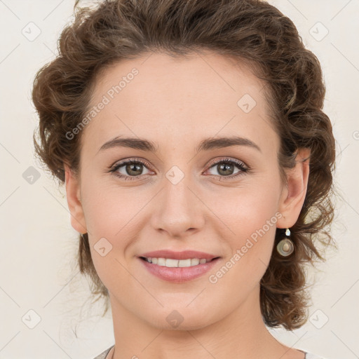 Joyful white young-adult female with medium  brown hair and green eyes