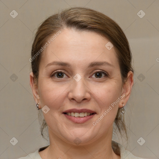 Joyful white adult female with medium  brown hair and brown eyes