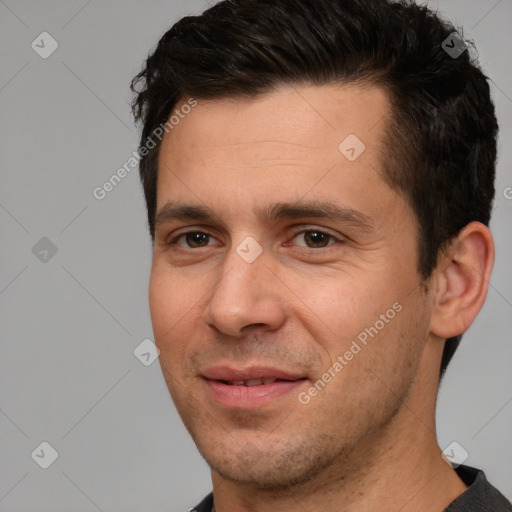 Joyful white adult male with short  brown hair and brown eyes