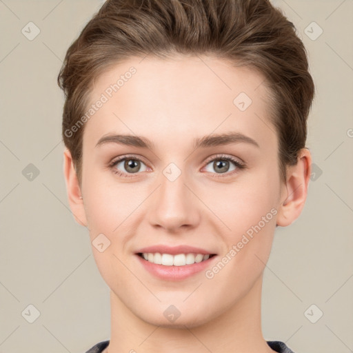 Joyful white young-adult female with short  brown hair and grey eyes