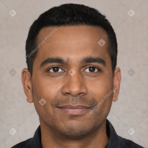 Joyful latino young-adult male with short  black hair and brown eyes