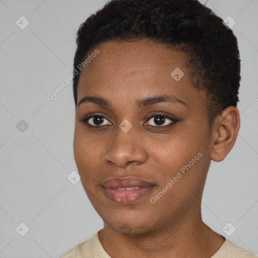 Joyful black young-adult female with short  black hair and brown eyes