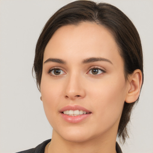 Joyful white young-adult female with medium  brown hair and brown eyes