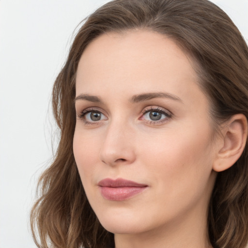 Neutral white young-adult female with long  brown hair and grey eyes