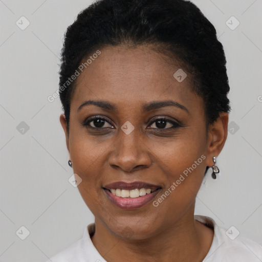 Joyful latino young-adult female with short  black hair and brown eyes