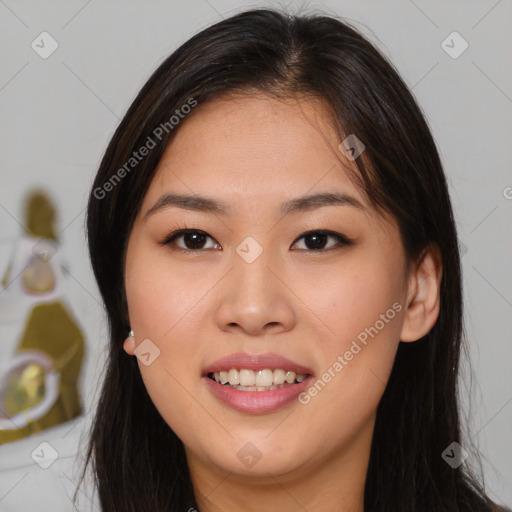 Joyful asian young-adult female with long  brown hair and brown eyes