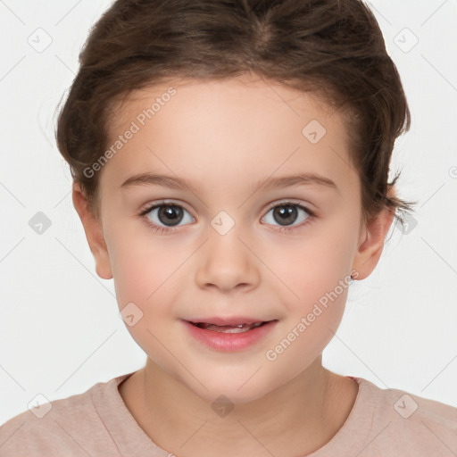 Joyful white child female with short  brown hair and brown eyes