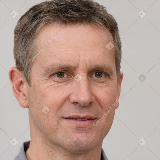 Joyful white adult male with short  brown hair and grey eyes