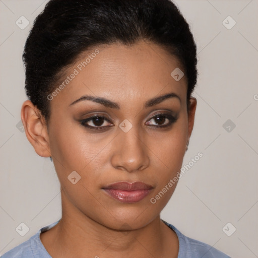 Joyful latino young-adult female with short  brown hair and brown eyes