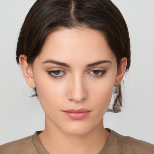 Neutral white young-adult female with medium  brown hair and brown eyes