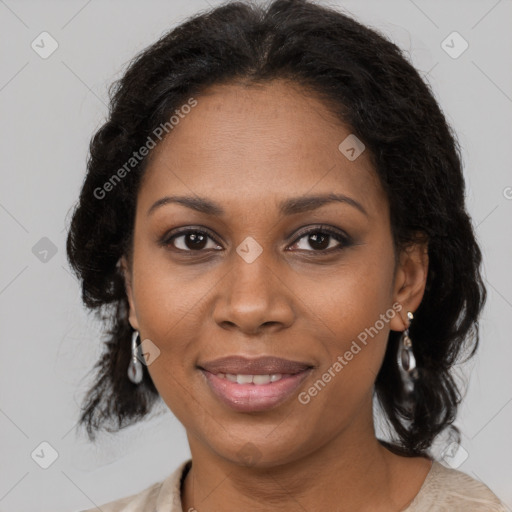 Joyful black adult female with medium  brown hair and brown eyes