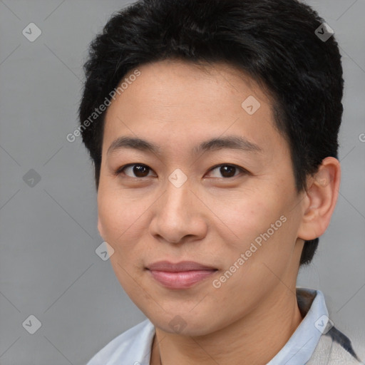 Joyful asian young-adult male with short  brown hair and brown eyes