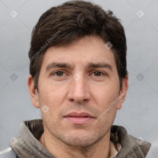 Joyful white adult male with short  brown hair and grey eyes