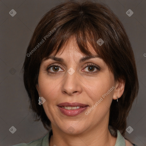 Joyful white adult female with medium  brown hair and brown eyes