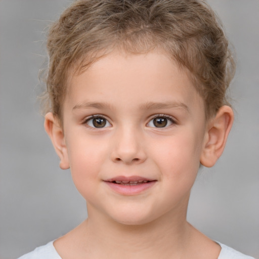 Joyful white child female with short  brown hair and brown eyes