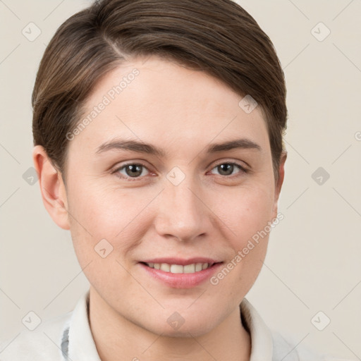 Joyful white young-adult female with short  brown hair and brown eyes