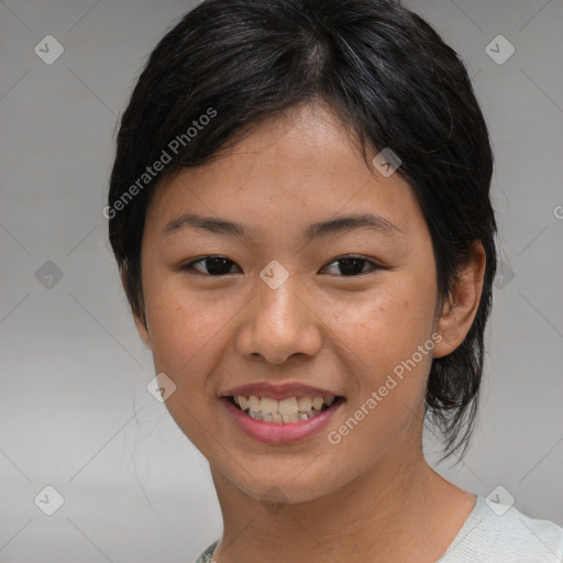 Joyful asian young-adult female with medium  black hair and brown eyes