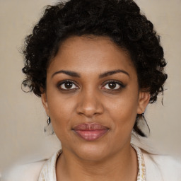 Joyful black young-adult female with medium  brown hair and brown eyes