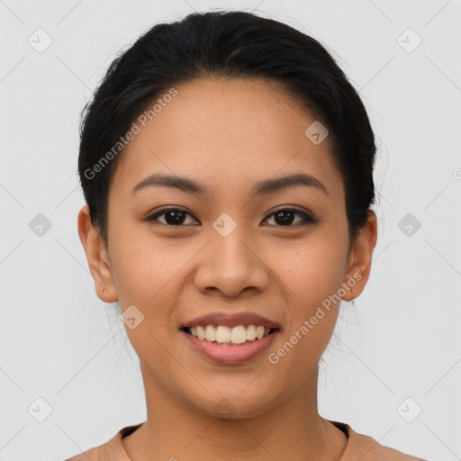 Joyful latino young-adult female with short  black hair and brown eyes