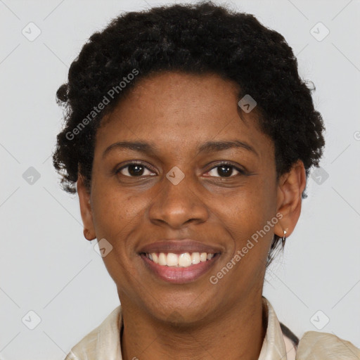 Joyful black young-adult female with short  brown hair and brown eyes