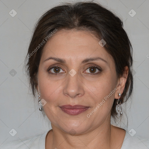 Joyful white adult female with medium  brown hair and brown eyes