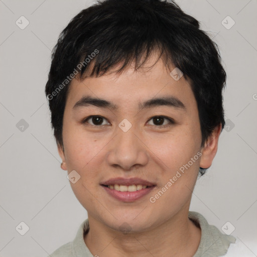 Joyful asian young-adult male with short  black hair and brown eyes