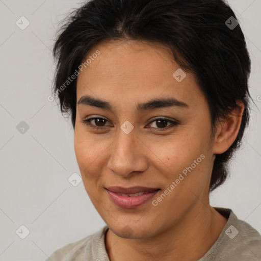 Joyful latino young-adult female with short  brown hair and brown eyes