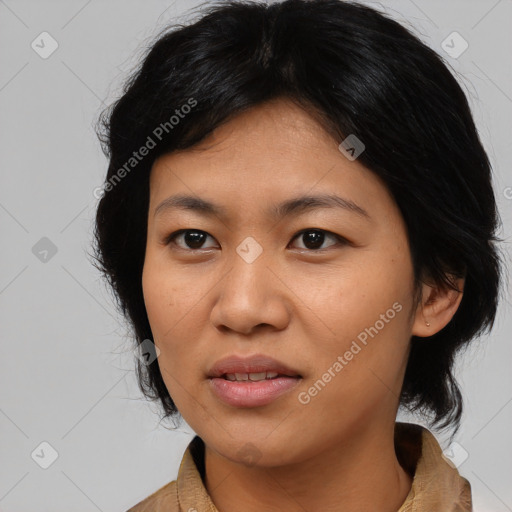 Joyful asian young-adult female with medium  black hair and brown eyes