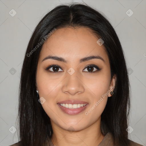 Joyful latino young-adult female with long  brown hair and brown eyes