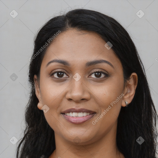 Joyful latino young-adult female with long  brown hair and brown eyes