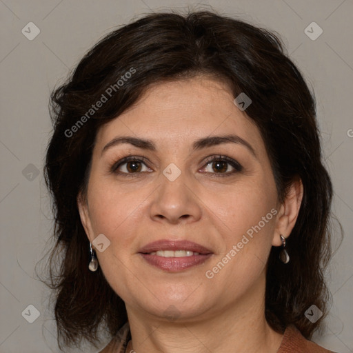 Joyful white adult female with medium  brown hair and brown eyes