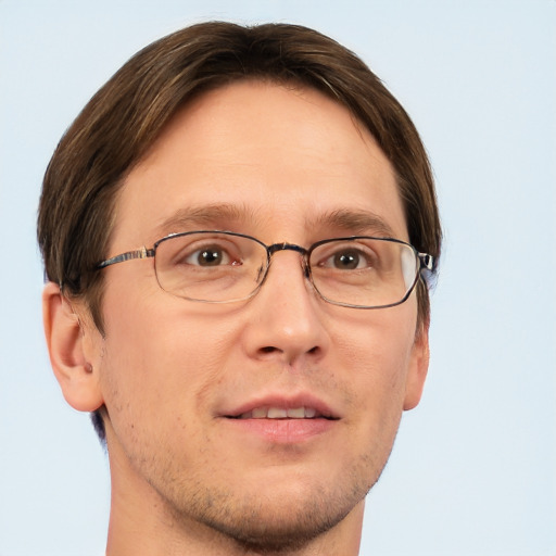 Joyful white adult male with short  brown hair and grey eyes