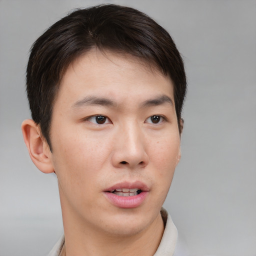 Neutral asian young-adult male with short  brown hair and brown eyes