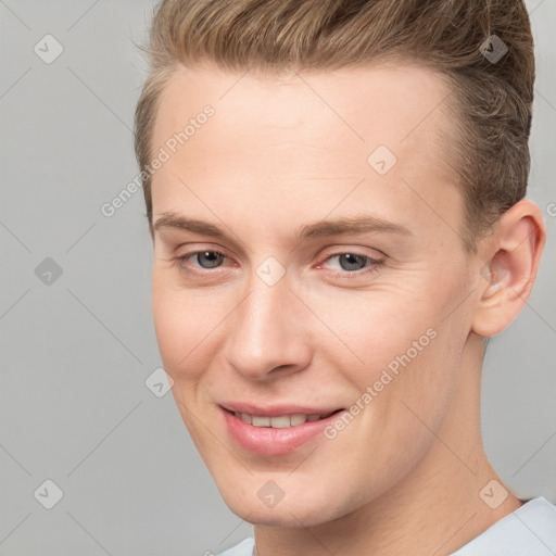 Joyful white young-adult male with short  brown hair and brown eyes