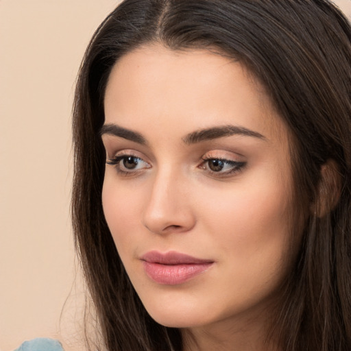 Neutral white young-adult female with long  brown hair and brown eyes