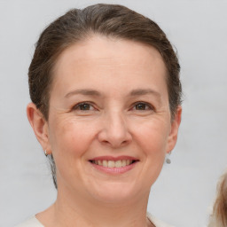 Joyful white adult female with short  brown hair and brown eyes