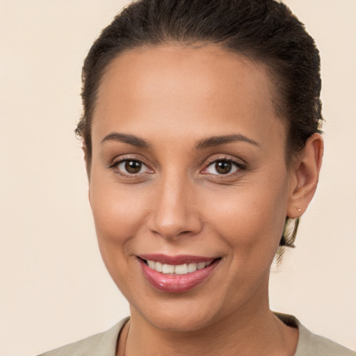 Joyful white young-adult female with short  brown hair and brown eyes