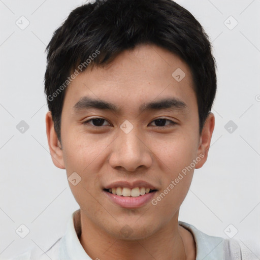 Joyful asian young-adult male with short  black hair and brown eyes