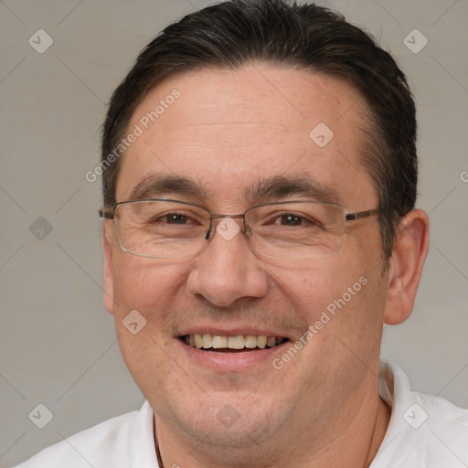 Joyful white adult male with short  brown hair and brown eyes