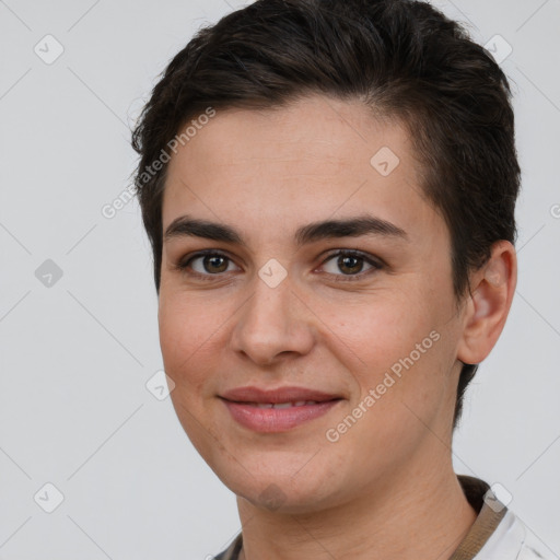 Joyful white young-adult female with short  brown hair and brown eyes