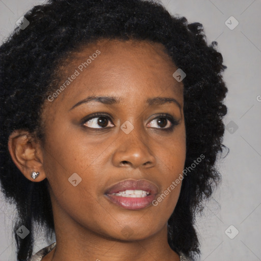 Neutral black young-adult female with long  brown hair and brown eyes