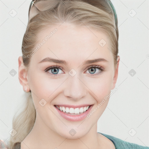 Joyful white young-adult female with long  brown hair and blue eyes