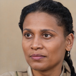 Joyful latino adult female with short  brown hair and brown eyes