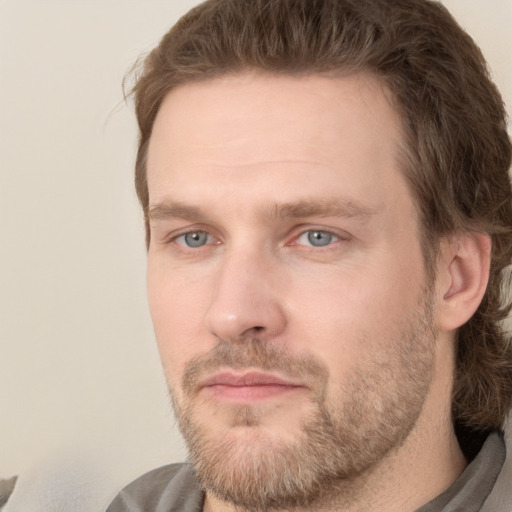 Joyful white adult male with short  brown hair and grey eyes