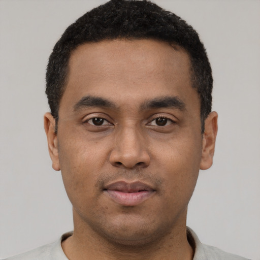 Neutral latino young-adult male with short  black hair and brown eyes