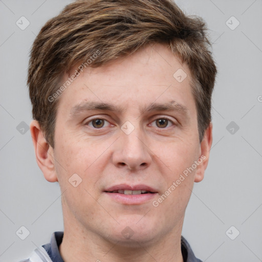 Joyful white adult male with short  brown hair and grey eyes