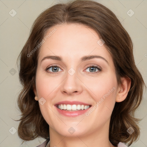 Joyful white young-adult female with medium  brown hair and green eyes