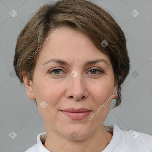 Joyful white adult female with short  brown hair and grey eyes